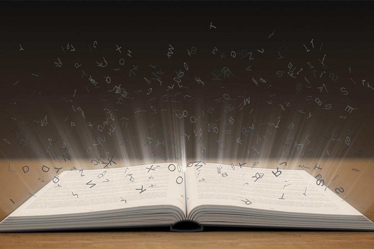 Words flying off an open book