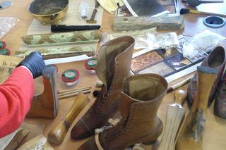 Person working with Bowes museum artifacts