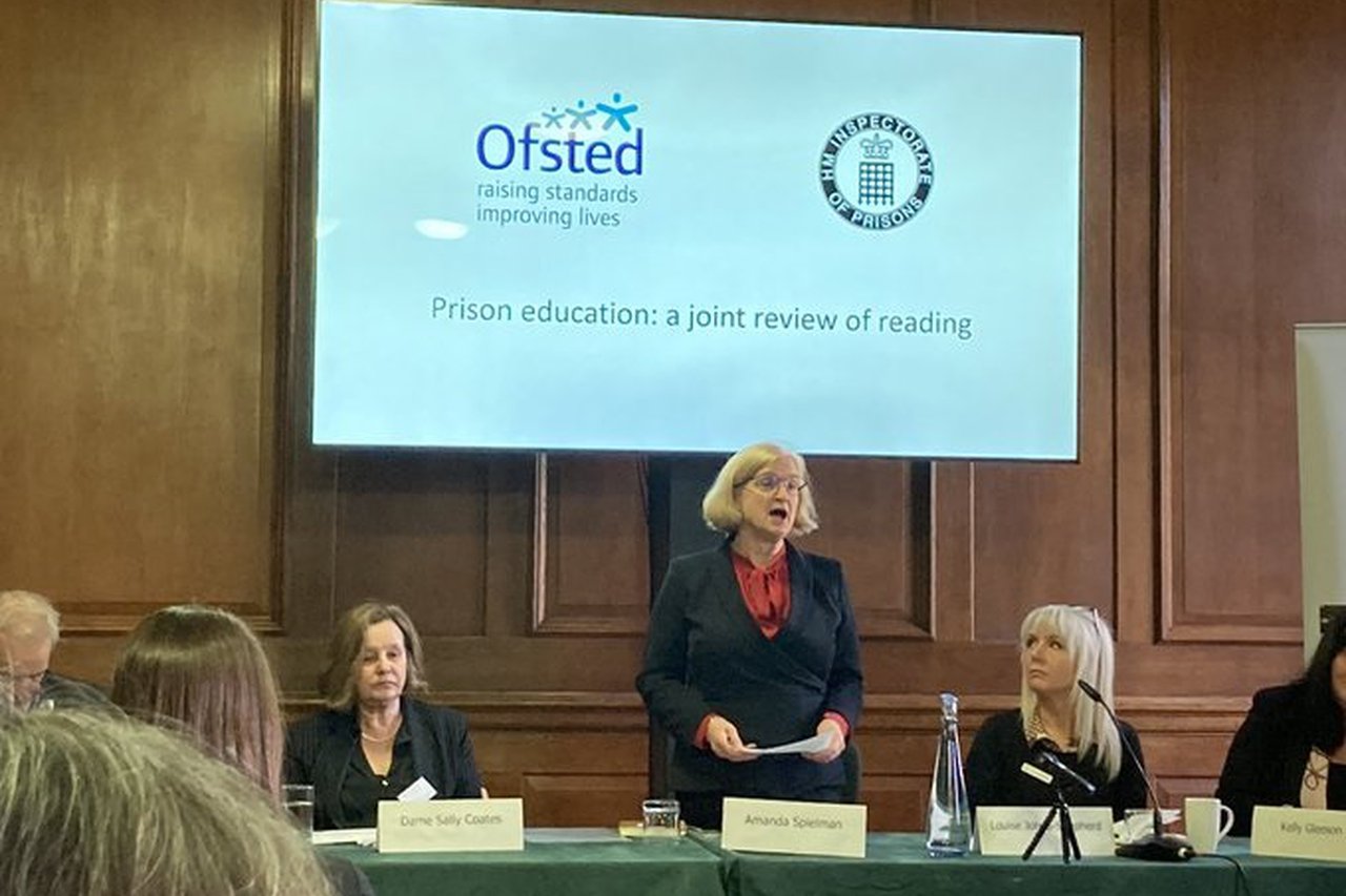 Speakers discussing the prison education review of reading