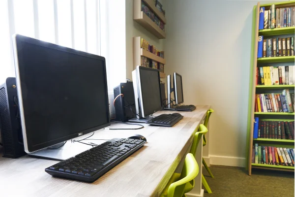 Novus digital skills classroom with computers set up for adult learners.