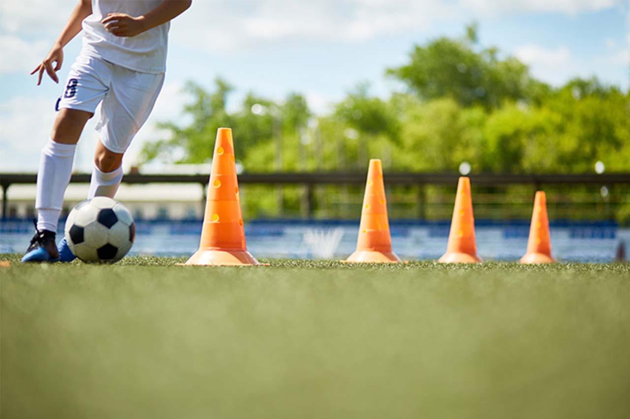 A footballer on a training pitch