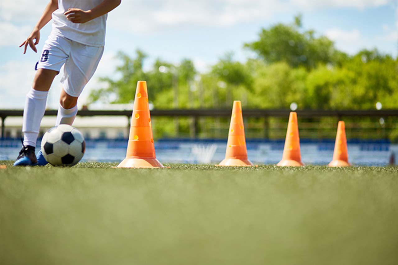 A footballer on a training pitch