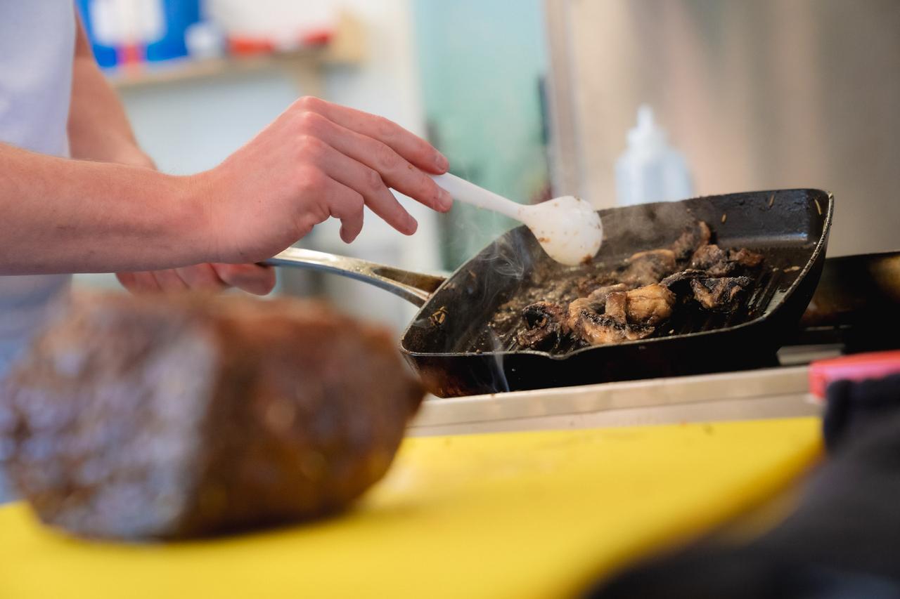 Prison learner cooking in education class