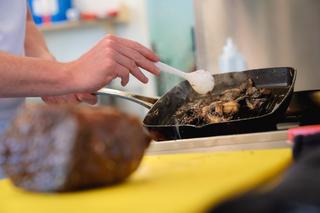 Prison learner cooking in education class