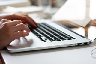 Hands typing on keyboard