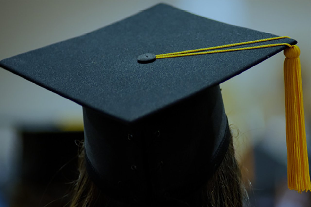 Close-up of someone wearing a graduation cap