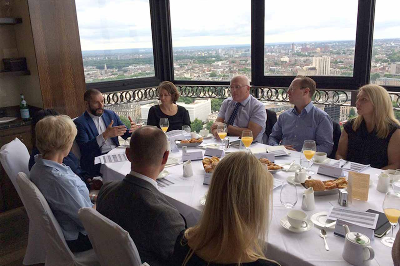 Novus colleagues talking around a table