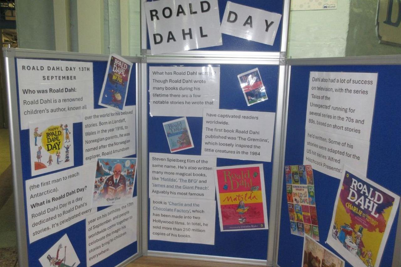 Display board about Roald Dahl Day featuring information panels, book covers and educational materials.