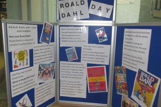 Display board about Roald Dahl Day featuring information panels, book covers and educational materials.