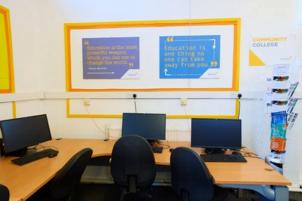 Computer room with motivational quotes stuck on the wall