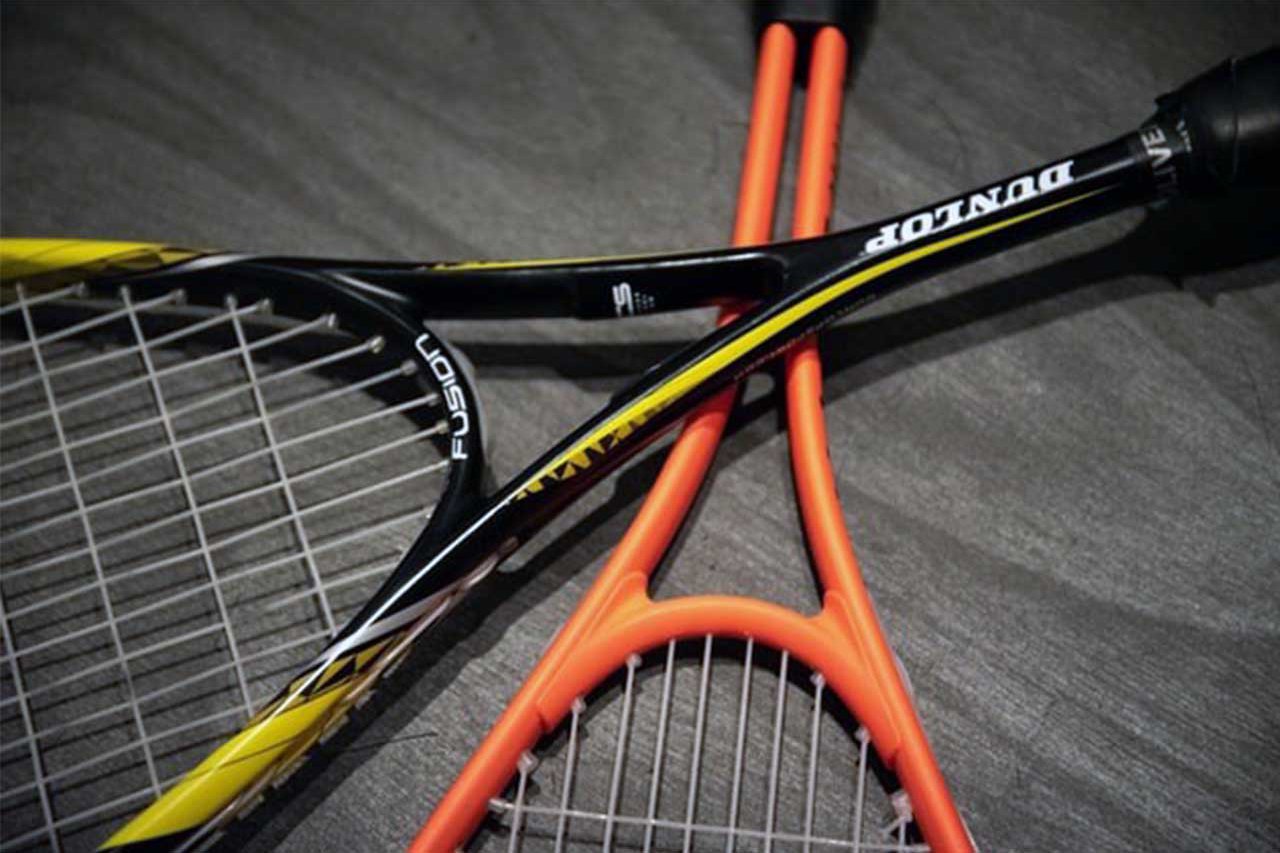 Close-up of two squash rackets