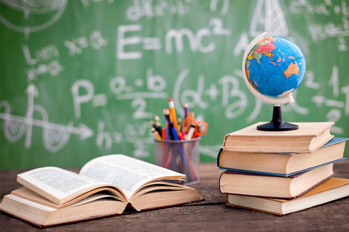 A world globe on top of a pile of books