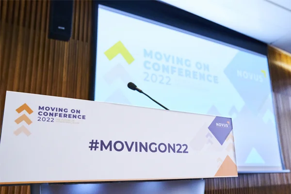 Close-up of a Novus conference stage set up for presentations and events.