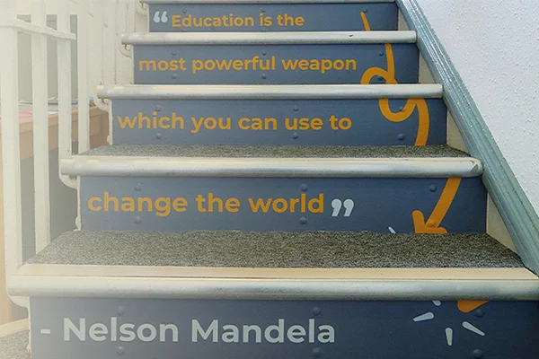 Staircase at Novus featuring an inspirational Nelson Mandela quote on the risers.