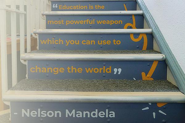Staircase at Novus featuring an inspirational Nelson Mandela quote on the risers.