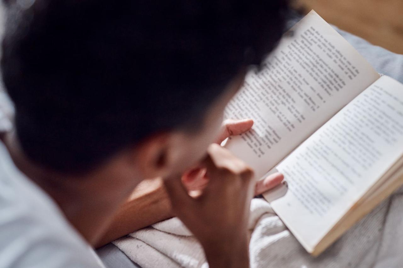 Prison learner reading a book