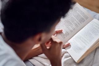 Prison learner reading a book