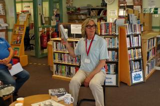 Mike Garry reading to learners in a prison library