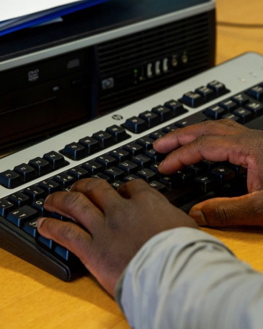Someone typing on a keyboard