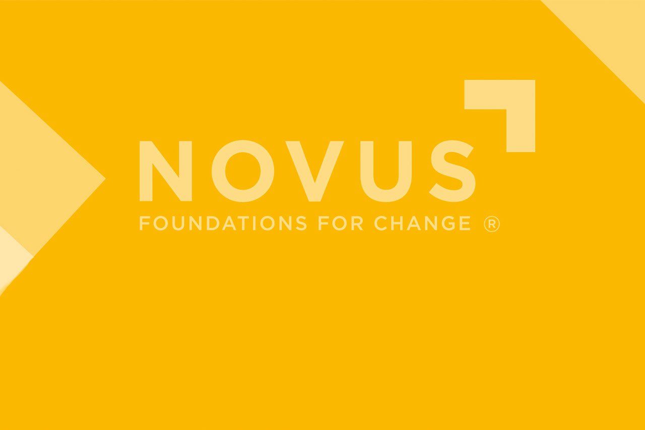 Novus logo on a yellow background