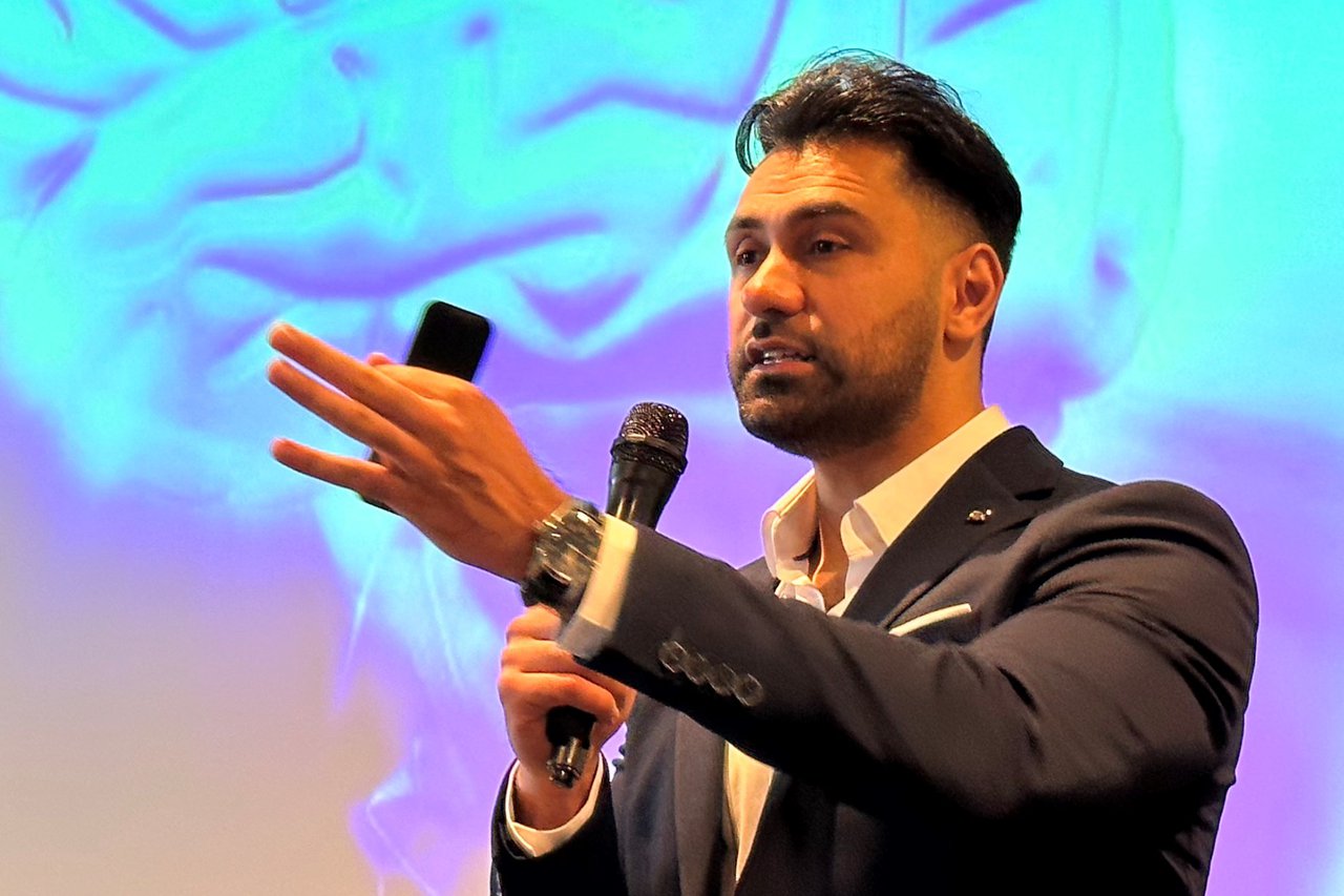 Adz Khan delivering a motivational speech