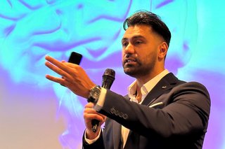 Adz Khan delivering a motivational speech