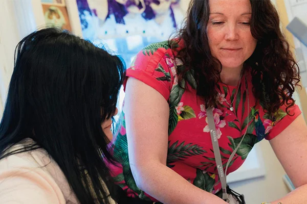 Novus tutor providing career guidance to an adult learner during a one-to-one session.