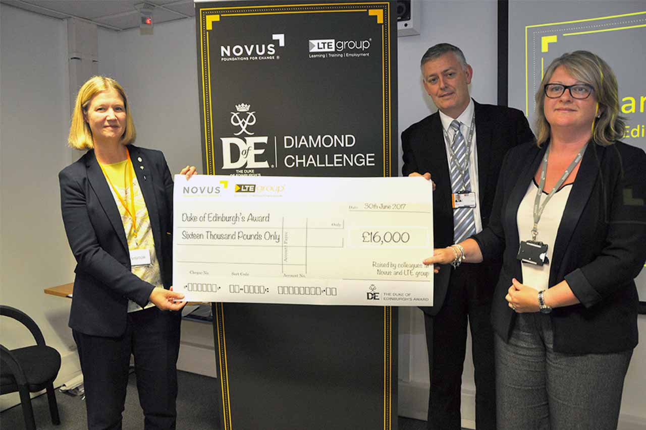 Presenting a cheque of £16,000 to the charity
