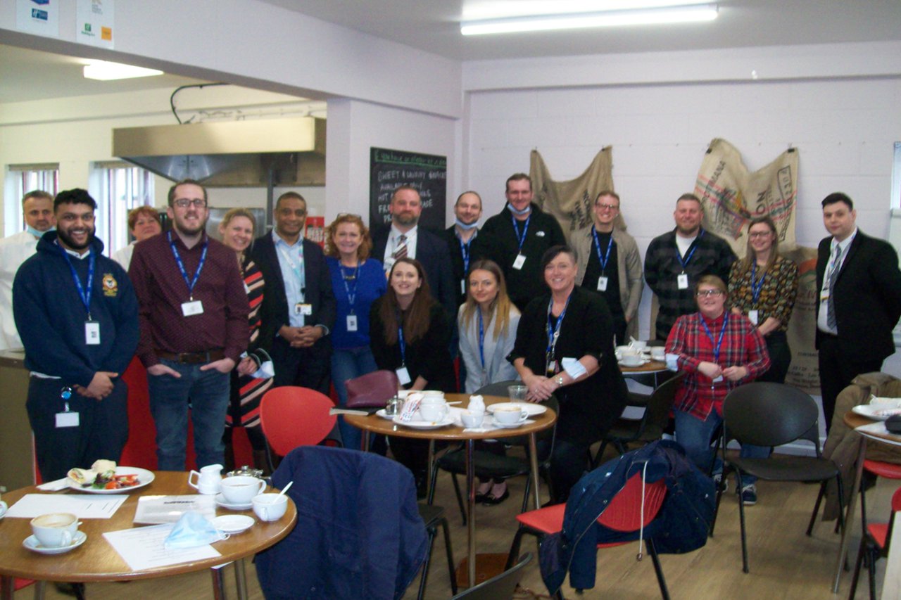 Group of people from Marston's visiting prison education setting