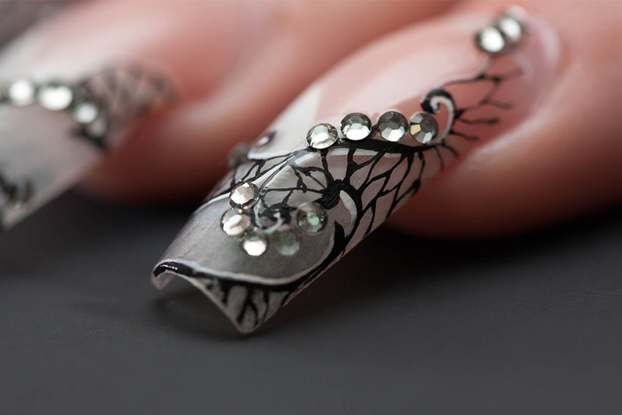 Close-up of pattern painted nails