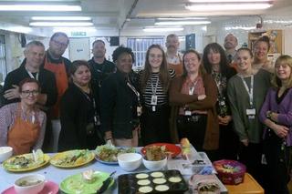 A group of HMP Wealstun colleagues smiling at the camera during the Magic Box Cooking Event