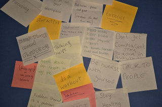 An assortment of different coloured post it notes with mental health and wellbeing advice written on each one from the learners perspective at HMP Hindley