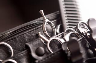 Hairdressing belt with hairdressing tools which includes scissors and combs