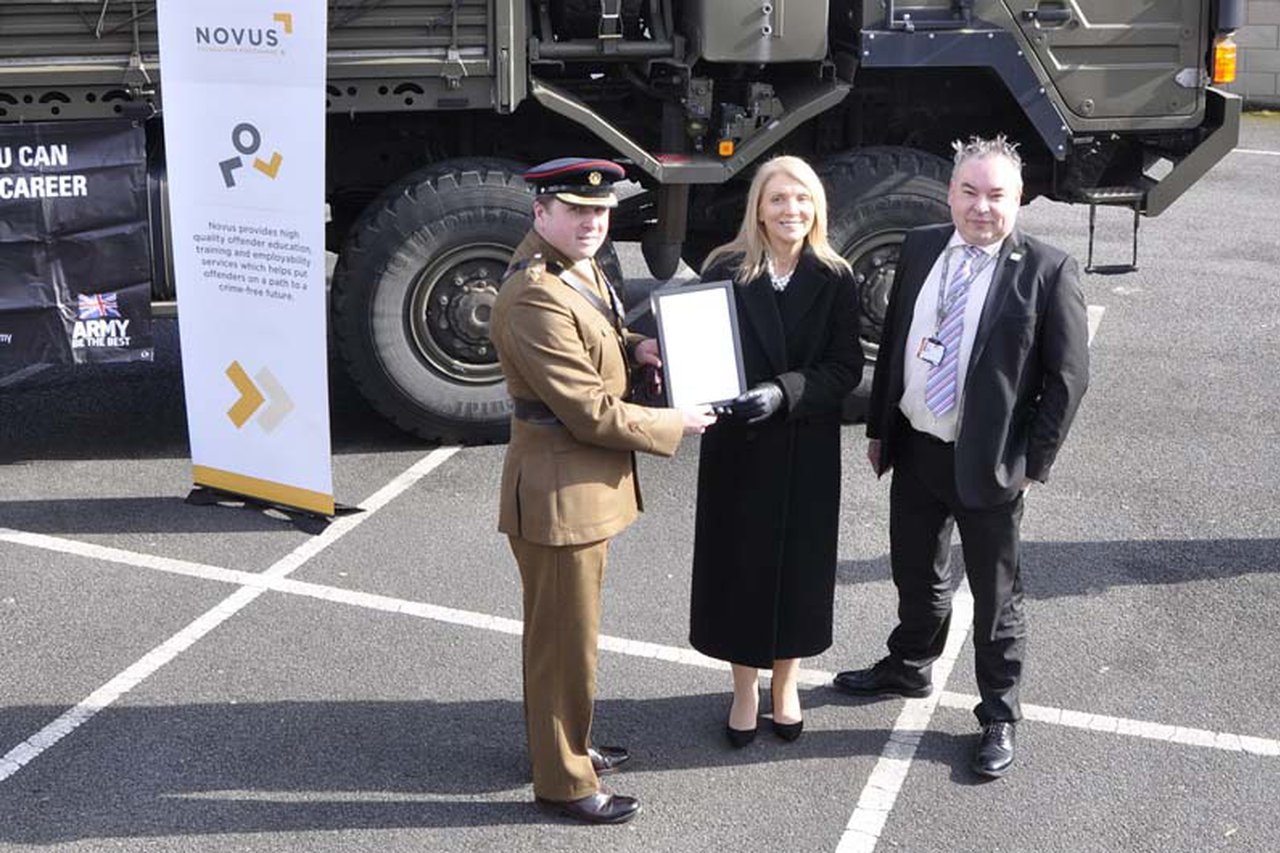 Lieutenant Colonel Tim Gould handing over pledge recognition