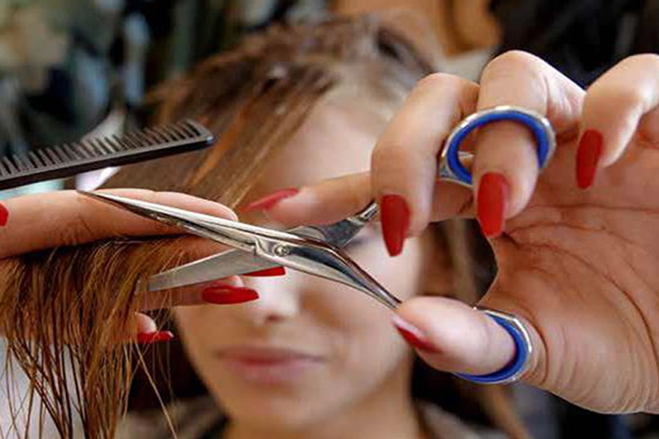 Hairdresser styling someones hair