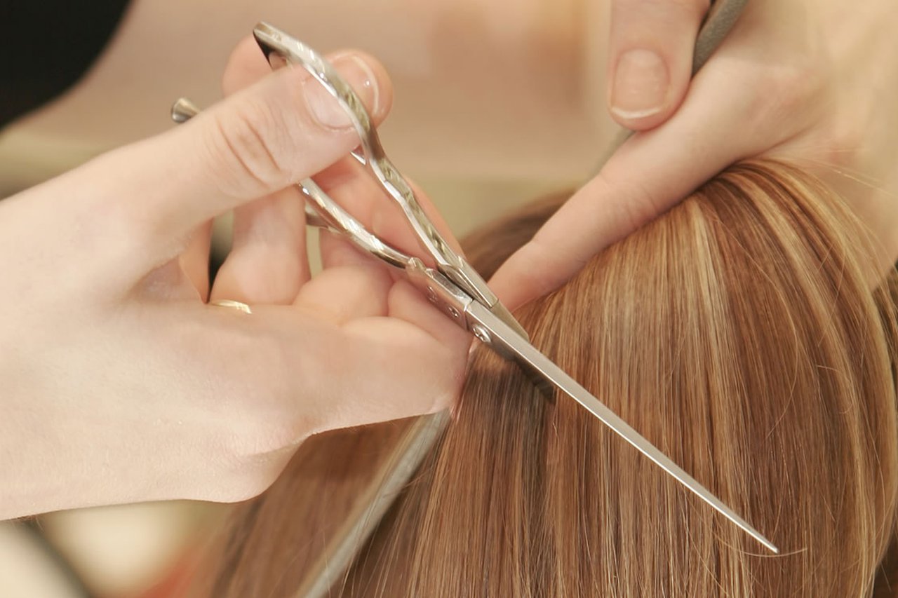 Hair being cut by scissors