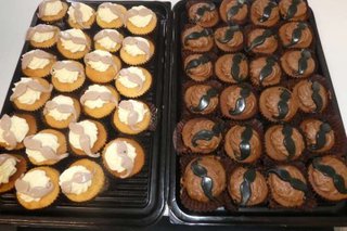 A batch of cupcakes with mustache icing