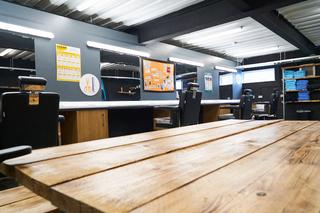 Wide shot of a Novus barbering facility